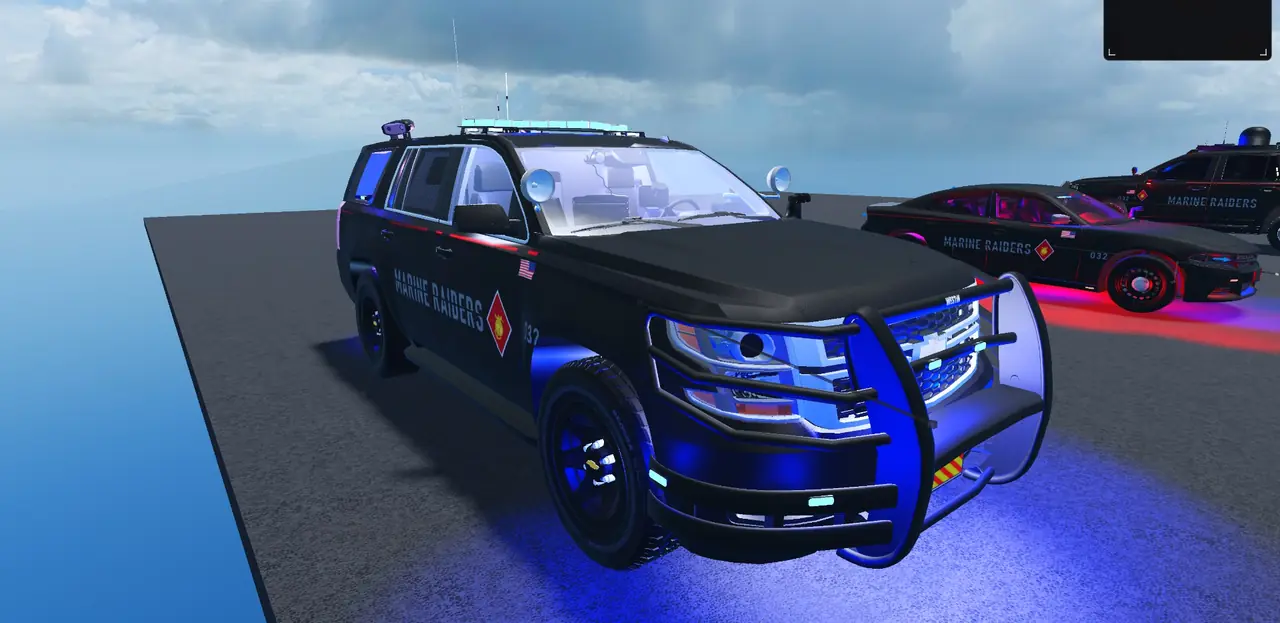 Army Military Police Tahoe with lights on