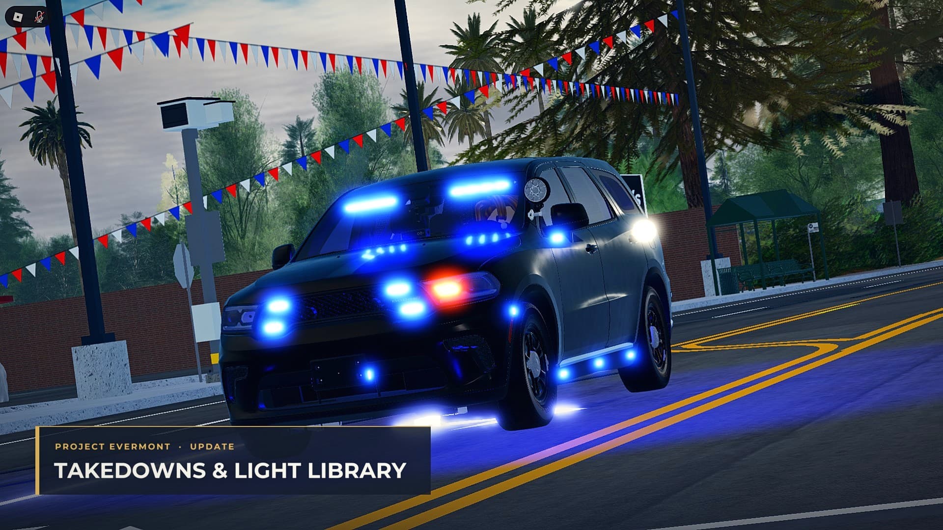 An unmarked Durango running blue lights under bunting