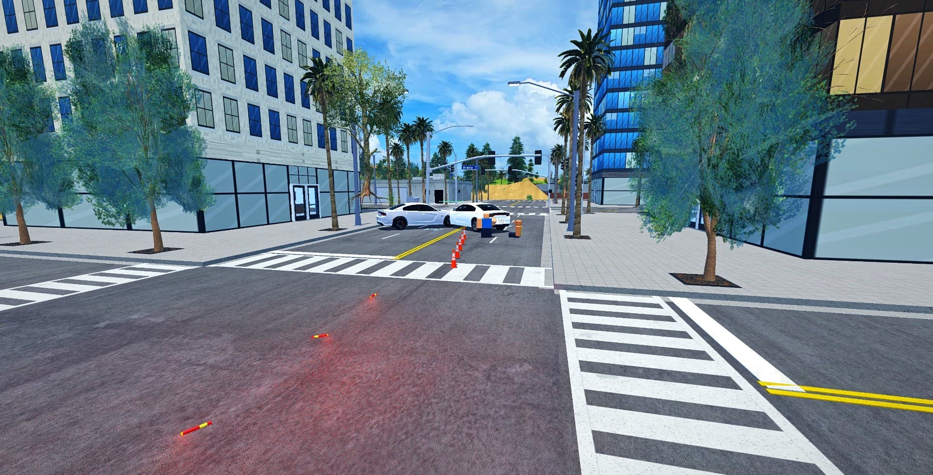 A crash callout with two damaged cars, debris and a cone taper along the lane