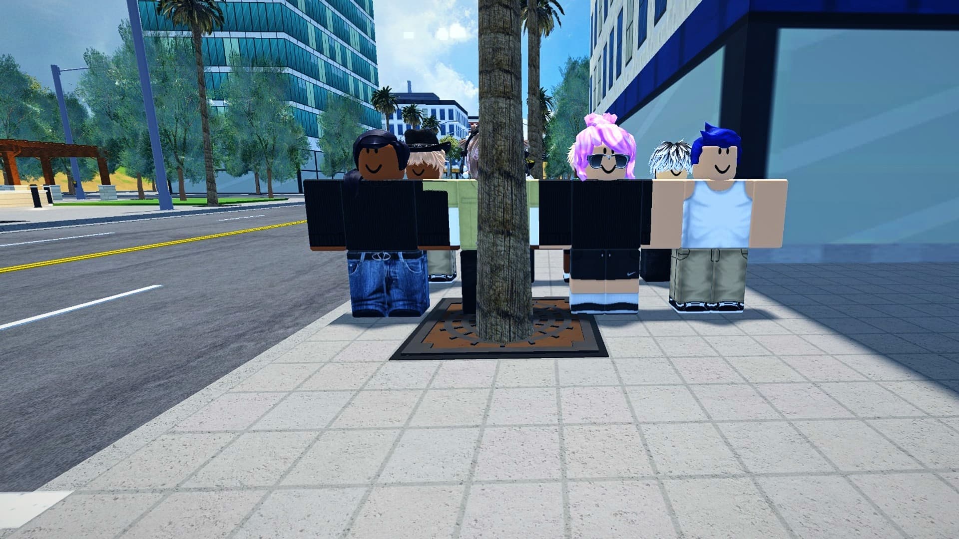 Pedestrians in everyday clothes on a downtown sidewalk